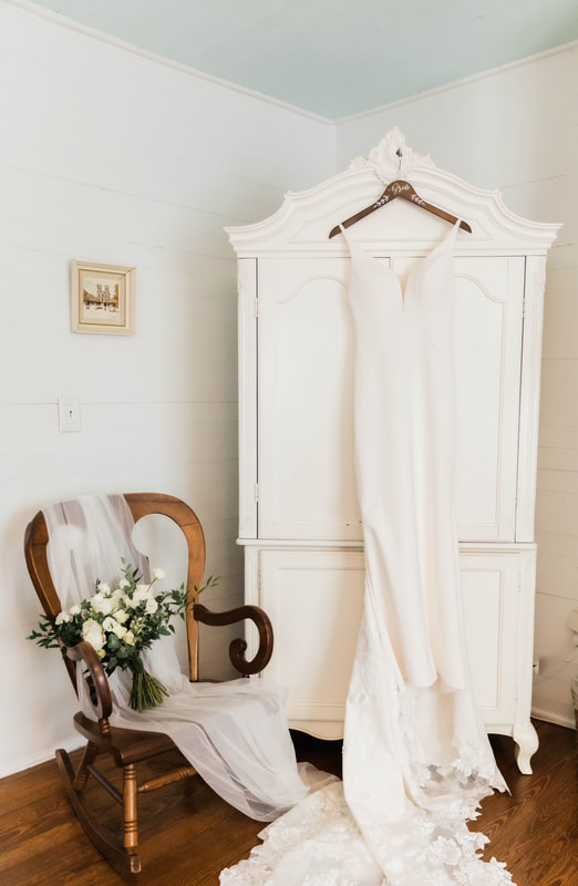 wedding dress on vintage white hutch and bridal details
