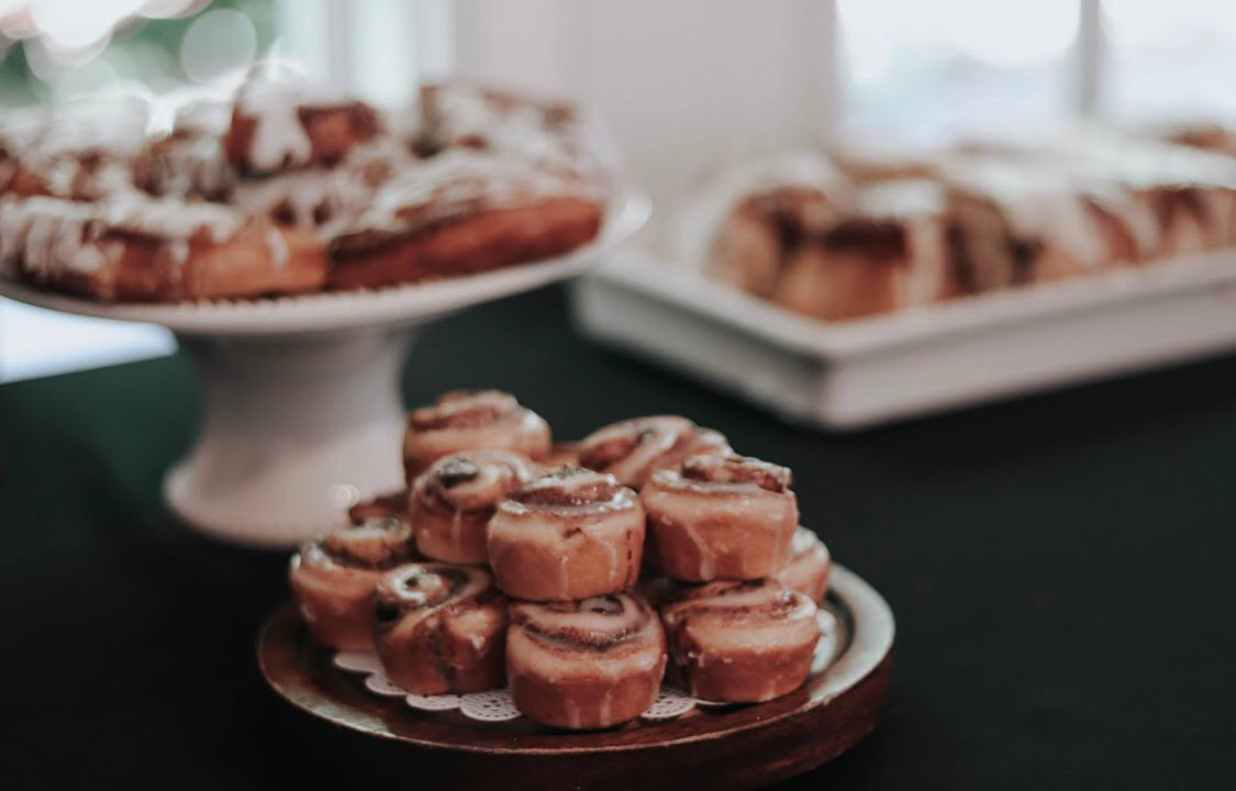 mini frosted cinnamon rolls on tray