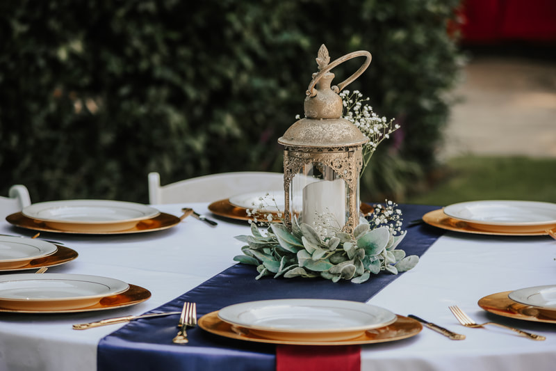 Disney tablescape with gold, navy, and burgundy decor