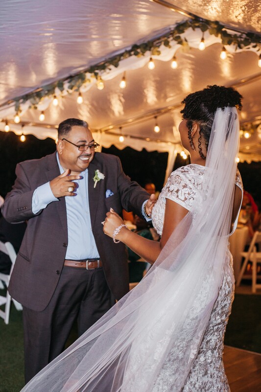 bride's first dance with father on outdoor dance floor