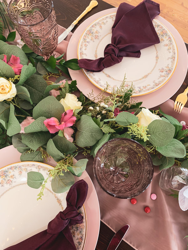 overhead photo of galentines party table decor