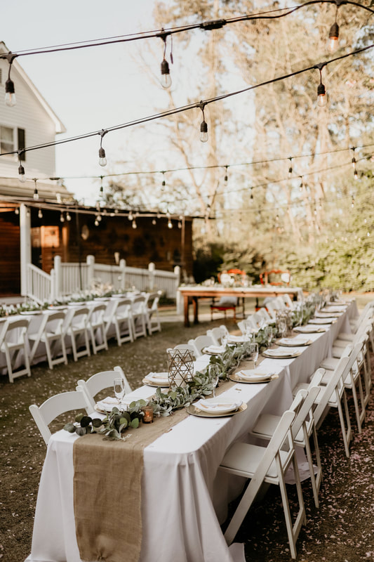 outdoor reception tables set up for a wedding