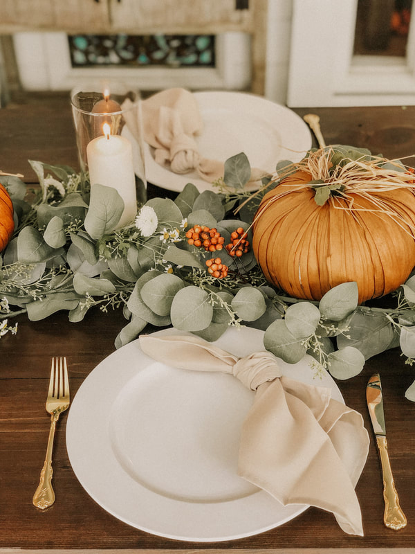 neutral fall place setting with gold flatware