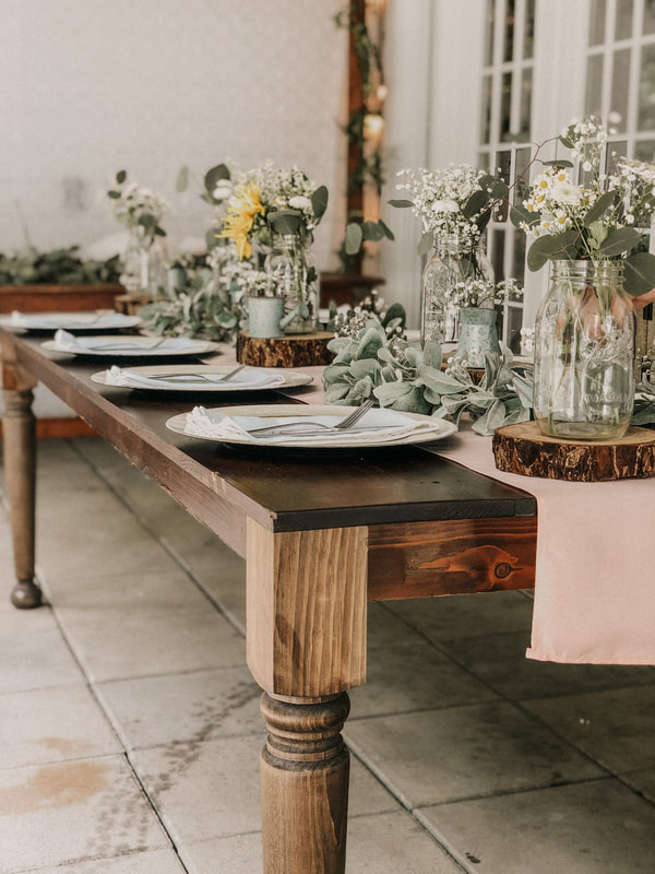 farmhouse table with matte blush runner and rustic decorations
