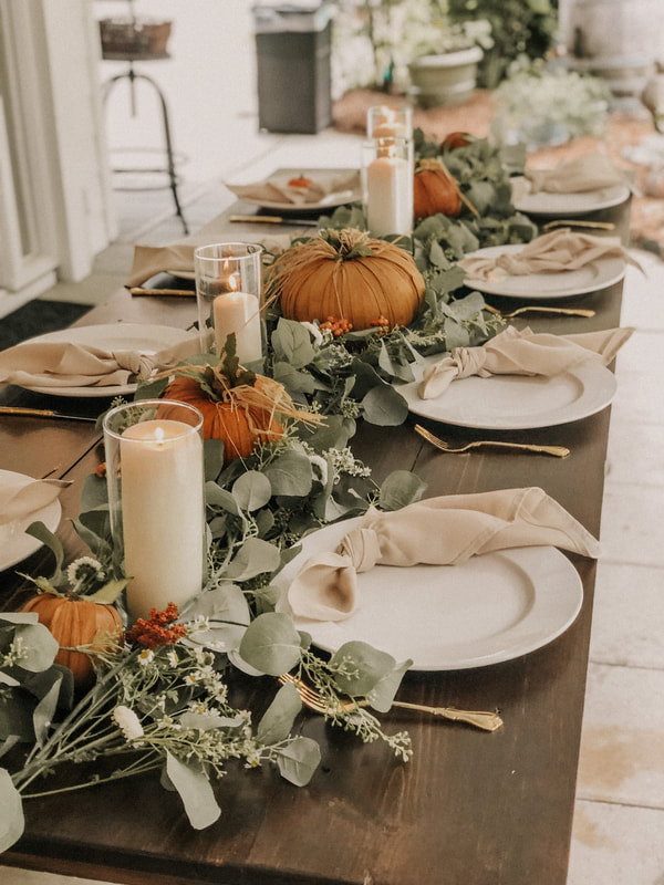 modern fall farmhouse table decorations with eucalyptus and pumpkins