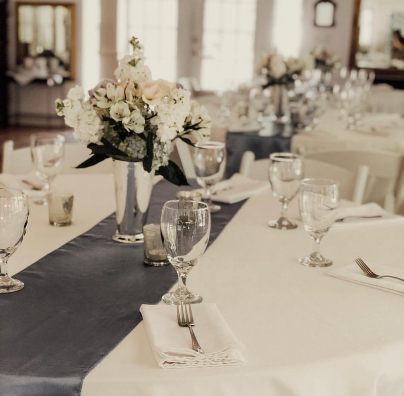 table with elegant floral arrangement in center