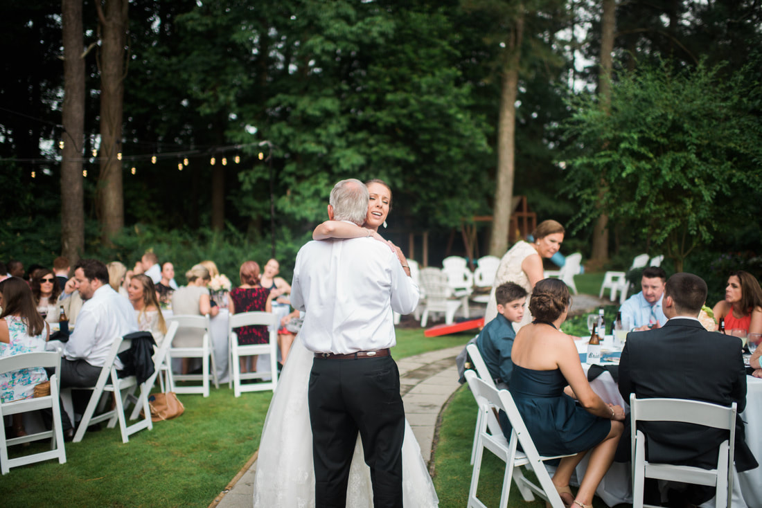 Father daughter dance at outdoor wedding reception