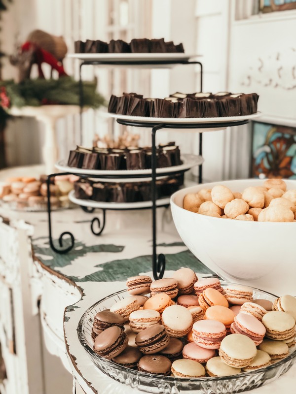 assorted mini desserts with macaroons, puffs, and chocolate bites