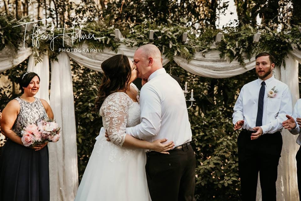 Bride and groom kissing after 'I do'