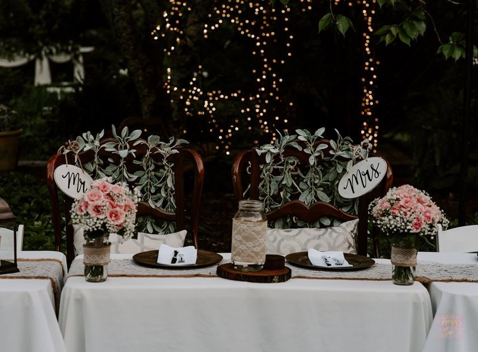 Mr. and Mrs. head table at April wedding
