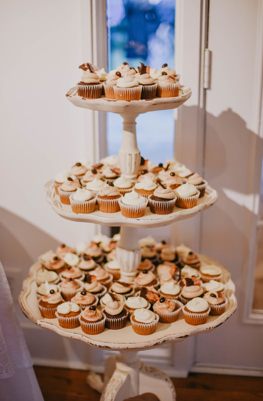 cupcakes on white tiered stand