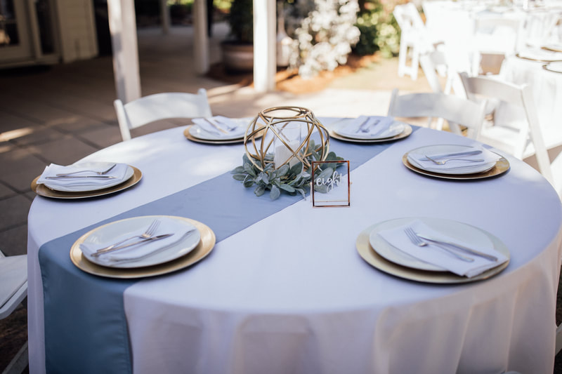 dusty blue and gold reception tables
