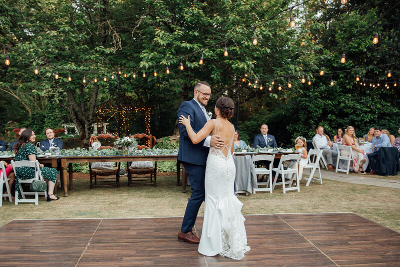 bride and groom dancing on outdoor dance floor