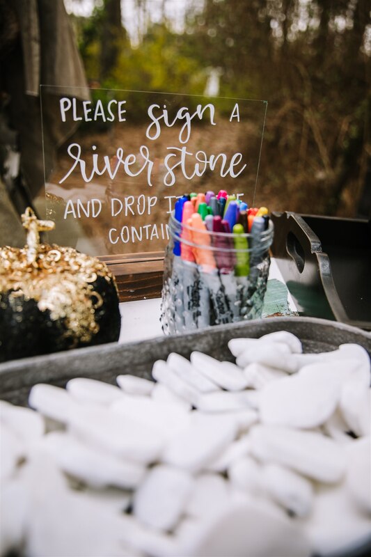 river stone guest book table