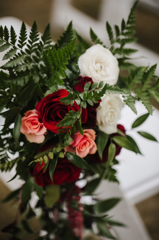 aisle chair floral arrangements with fern greenery and roses