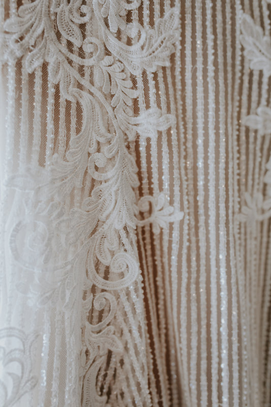 close-up details of boho chic wedding dress