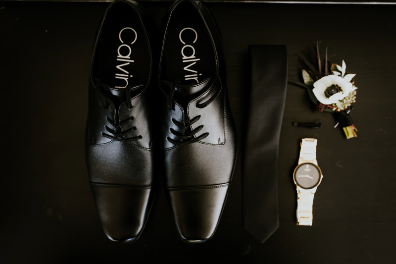 grooms shoes, tied, watch and boutonniere