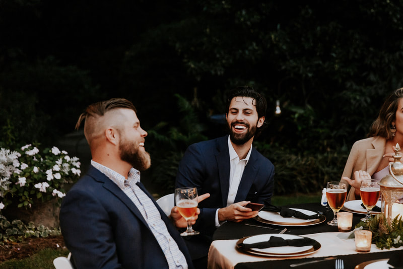 guests laughing during cocktail hour
