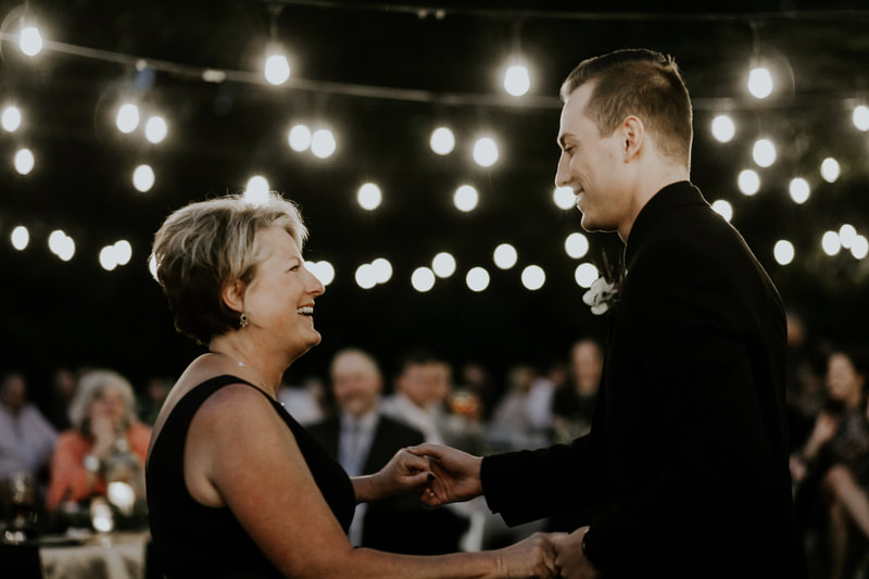 groom dancing with mom