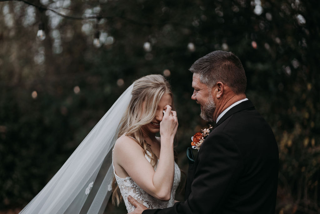 bride crying during first look with dad