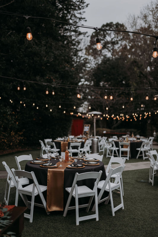 fall garden wedding reception with black and gold details