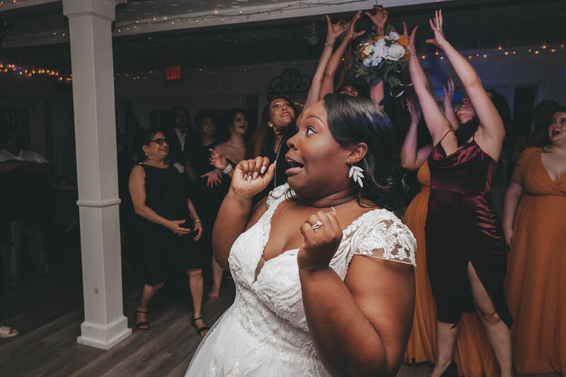 bride reacting to bouquet toss