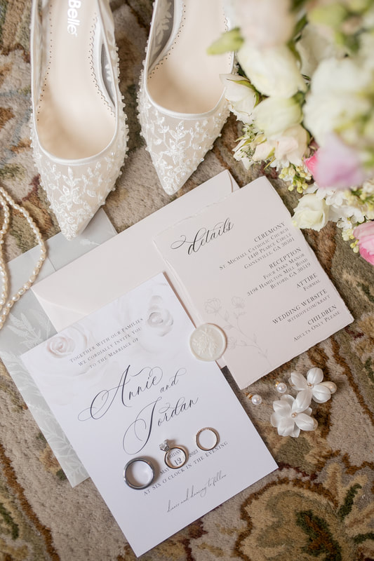 white classic wedding details with neutral floral print