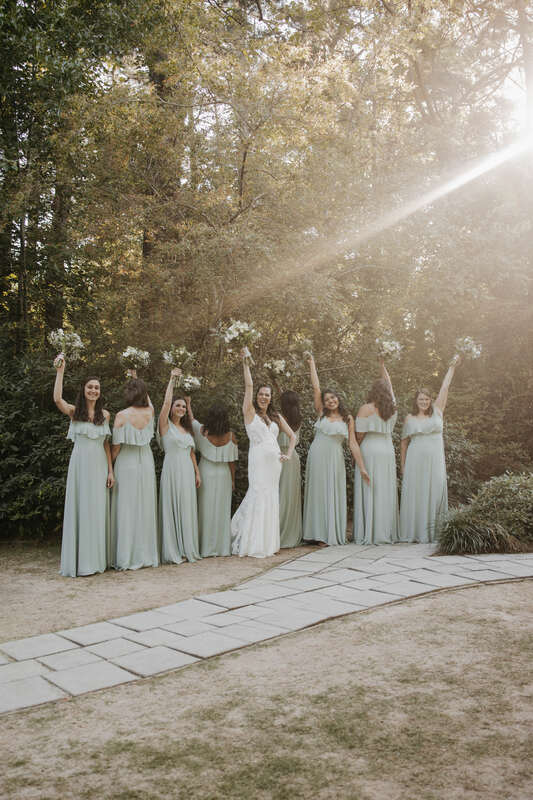 bridesmaids holding up bouquets