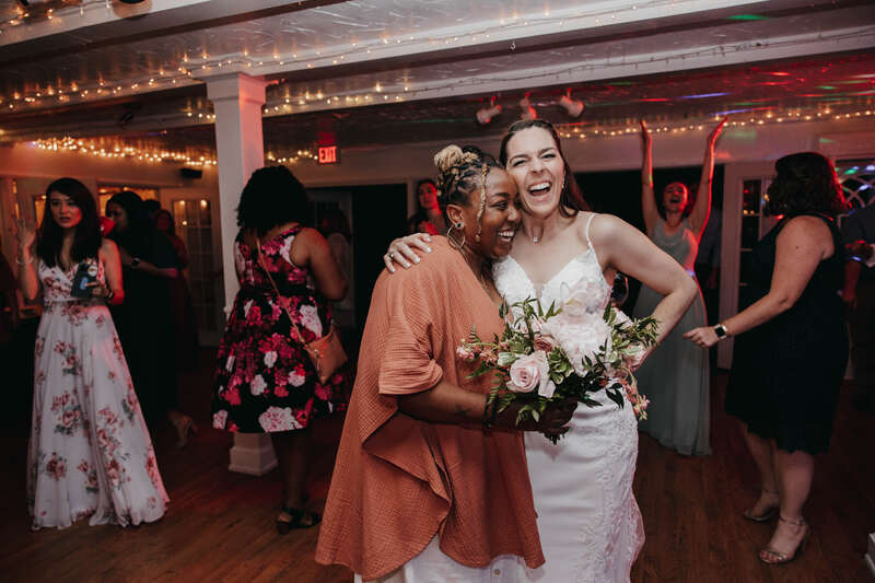 bride with guest who caught bouquet
