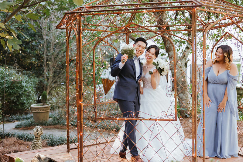 bride and groom reacting in gazebo after ceremony