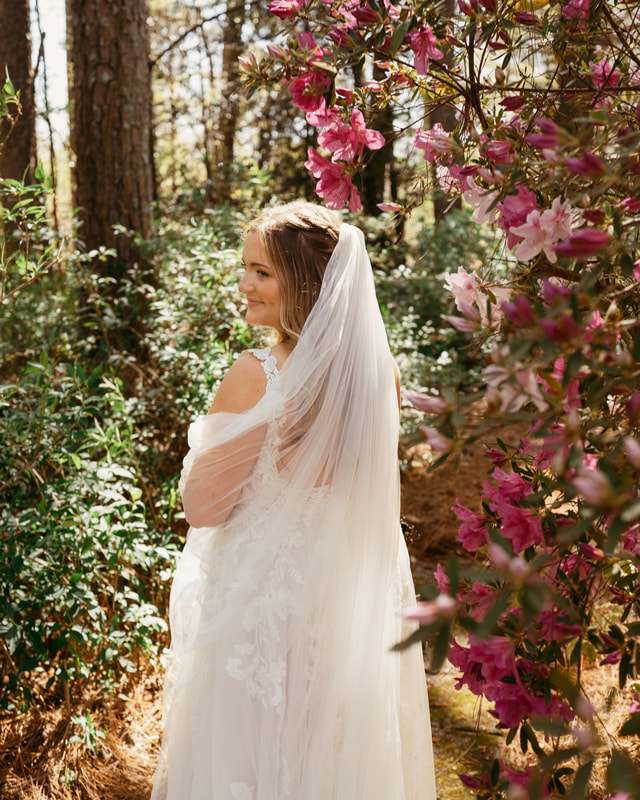 bride posing by azaleas