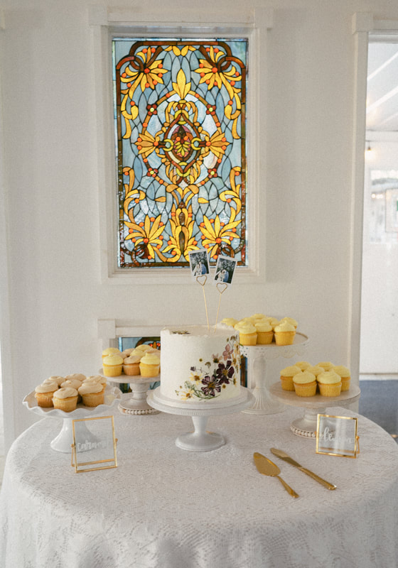 spring dessert table with floral pressed cutting cake and lemon cupcakes