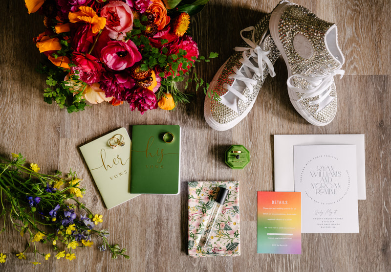 bold colorful wedding details flat lay
