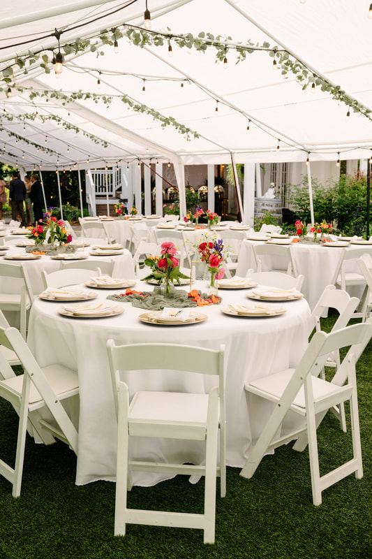 Tented reception with bright floral tablescapes