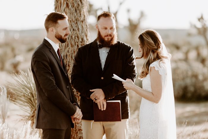 bride share personal vows with groom at desert wedding