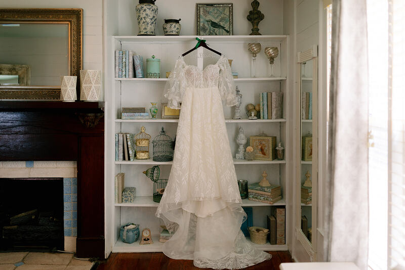 dress hanging on vintage farmhouse shelves