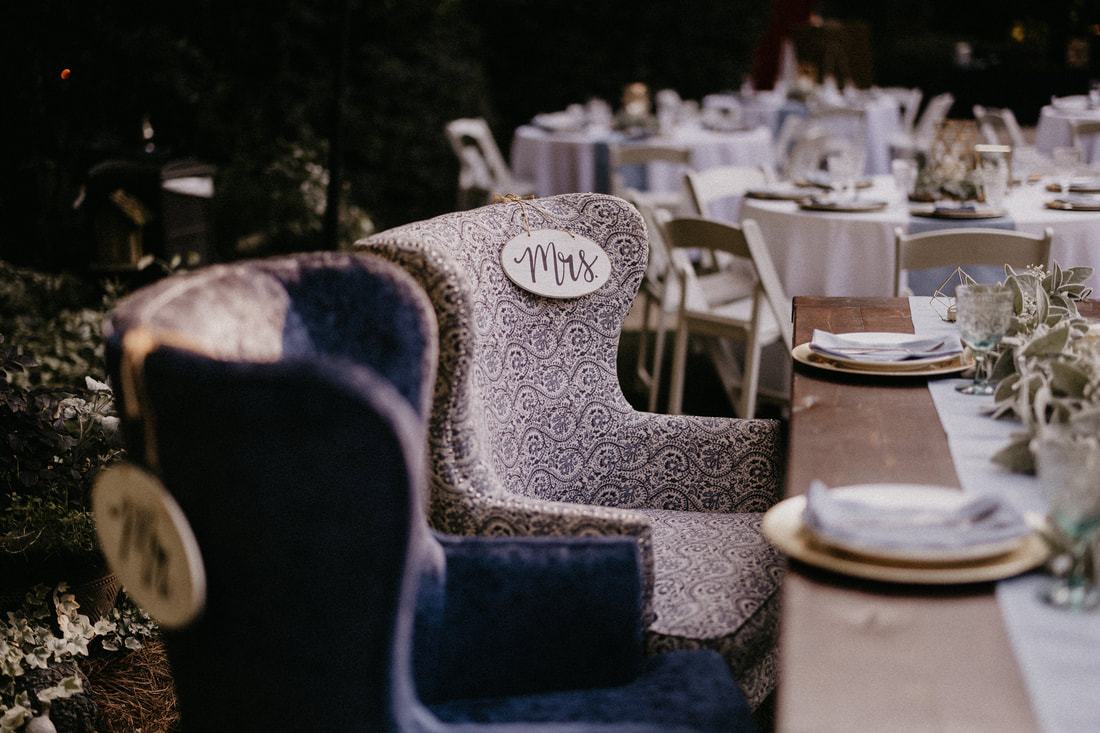 blue chairs at head table