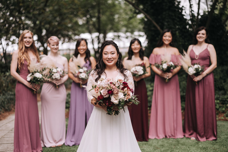 bride and bridesmaids in mismatched dresses
