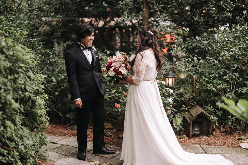first look between groom and bride in gardens