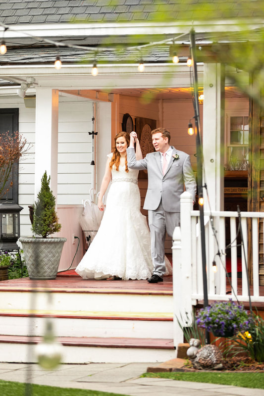 bride and groom introduced into reception from farmhouse back porch