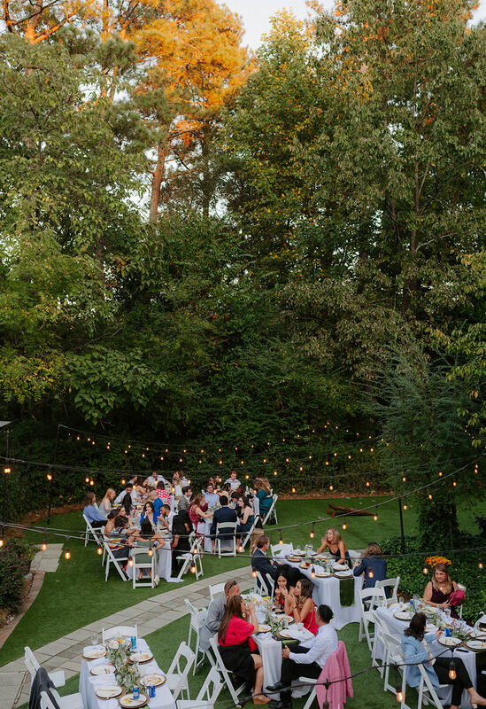 garden wedding reception under bistro lights