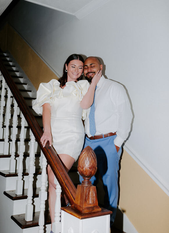flash photo of newlyweds in staircase