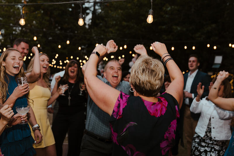 guests dancing at outdoor spring reception