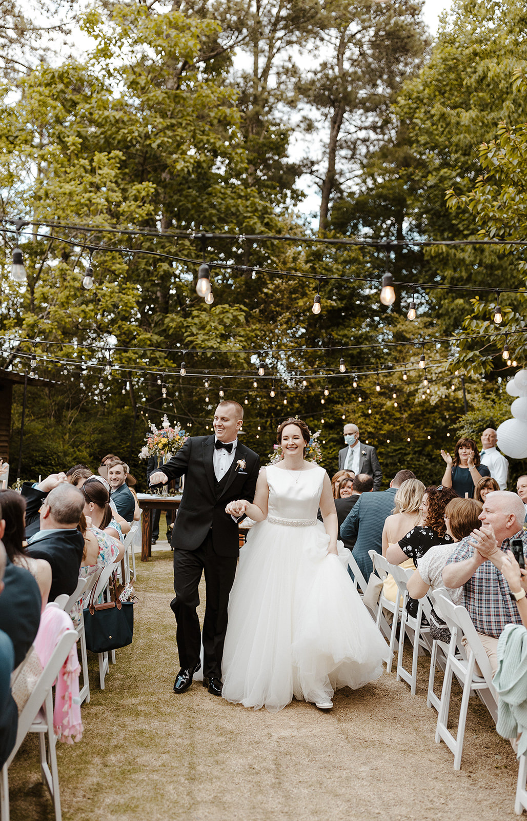 bride and groom announced into garden wedding reception