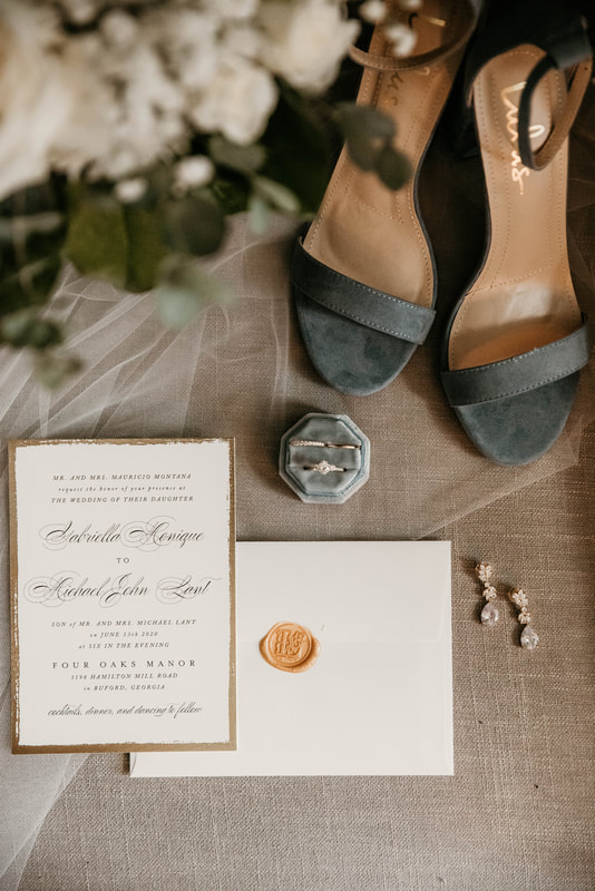 detail photo of gold and dusty blue wedding