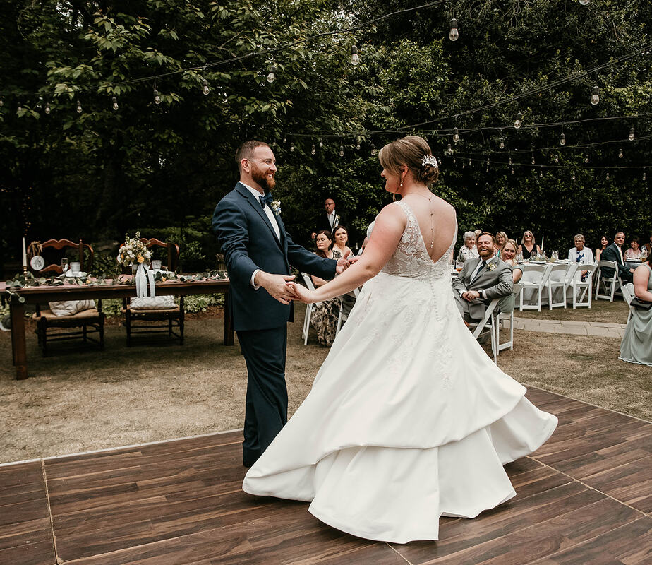 bride and groom dancing on outdoor dance floor