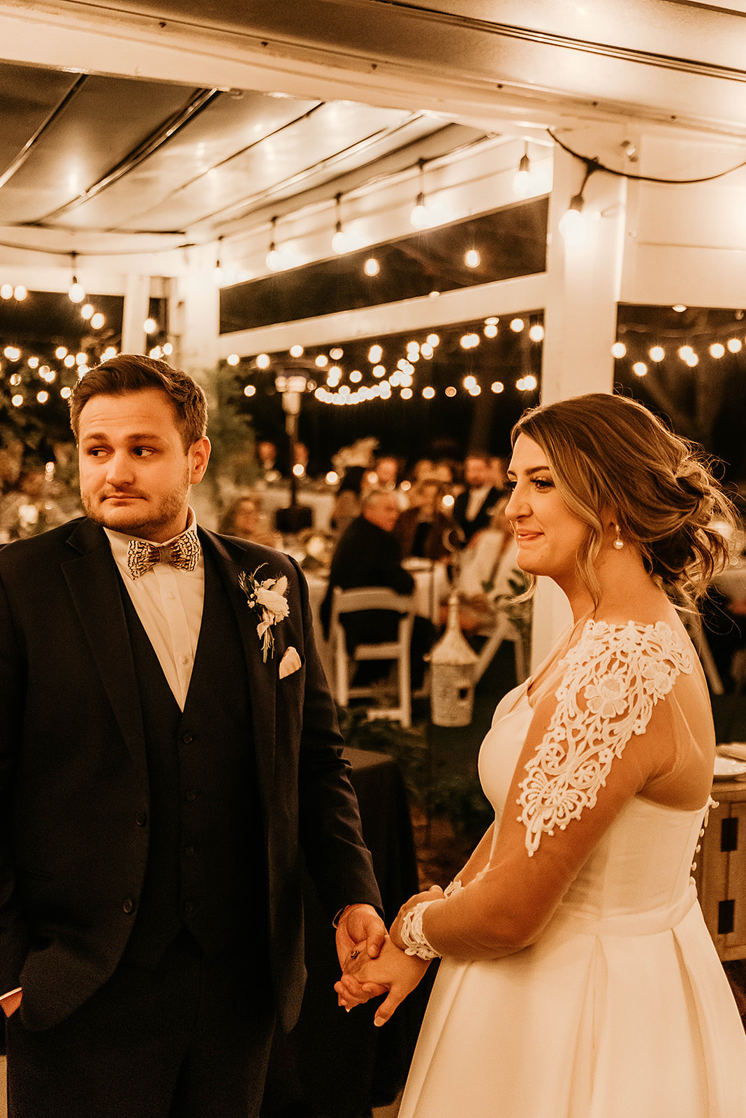 bride and groom listening to toasts at farmhouse venue
