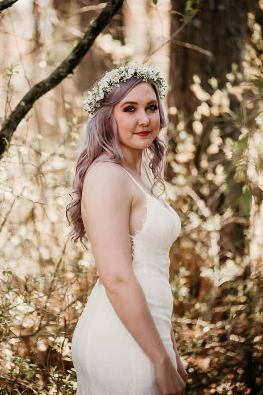 bride in lace dress with flower crown in lavender hair