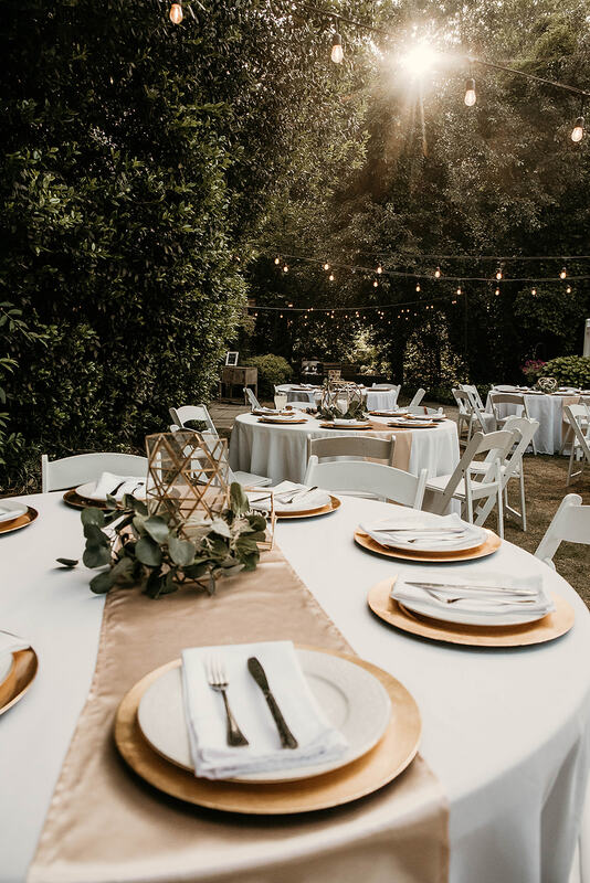 gold and greenery outdoor wedding reception tables