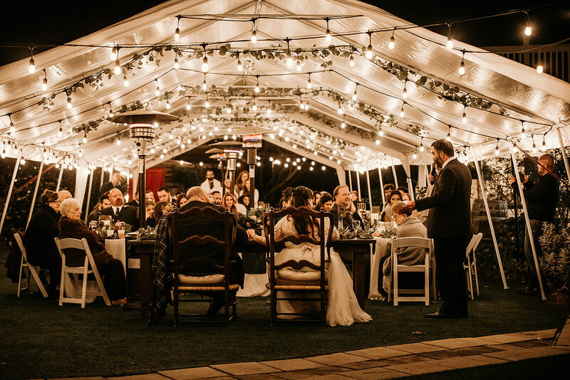 toasts under tented reception